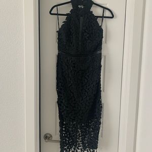 Black leaf dress. Knee length, low back, zipper, high neck